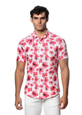 A man wearing a vibrant pink floral print open knit short-sleeved button-up shirt on a white background
