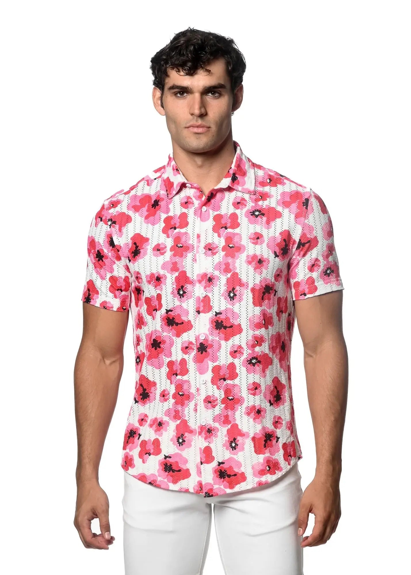 A man wearing a vibrant pink floral print open knit short-sleeved button-up shirt on a white background