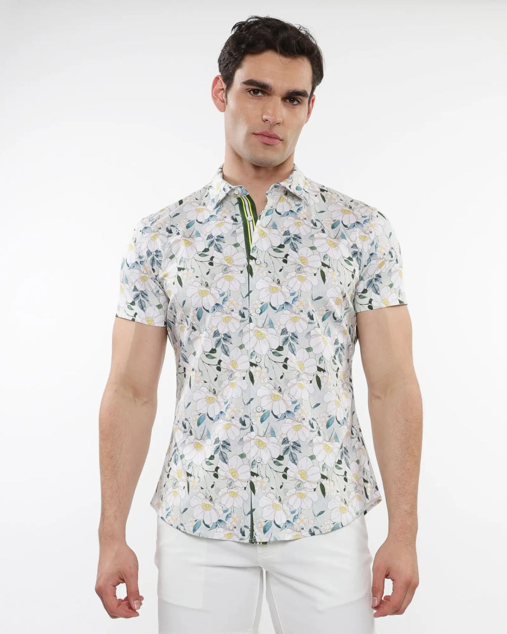 White short-sleeved stretch knit shirt with delicate green blue and yellow floral print for casual wear