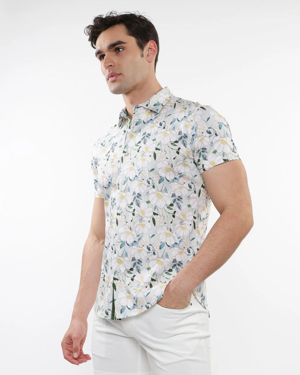 White short-sleeved stretch knit shirt with delicate green and yellow floral print perfect for casual wear