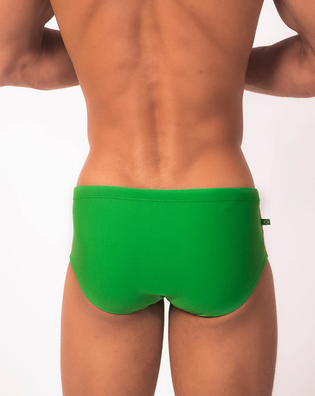 Bright green floripa trio sunga swim trunks with sleek form-fitting design and small brand tag on waistband