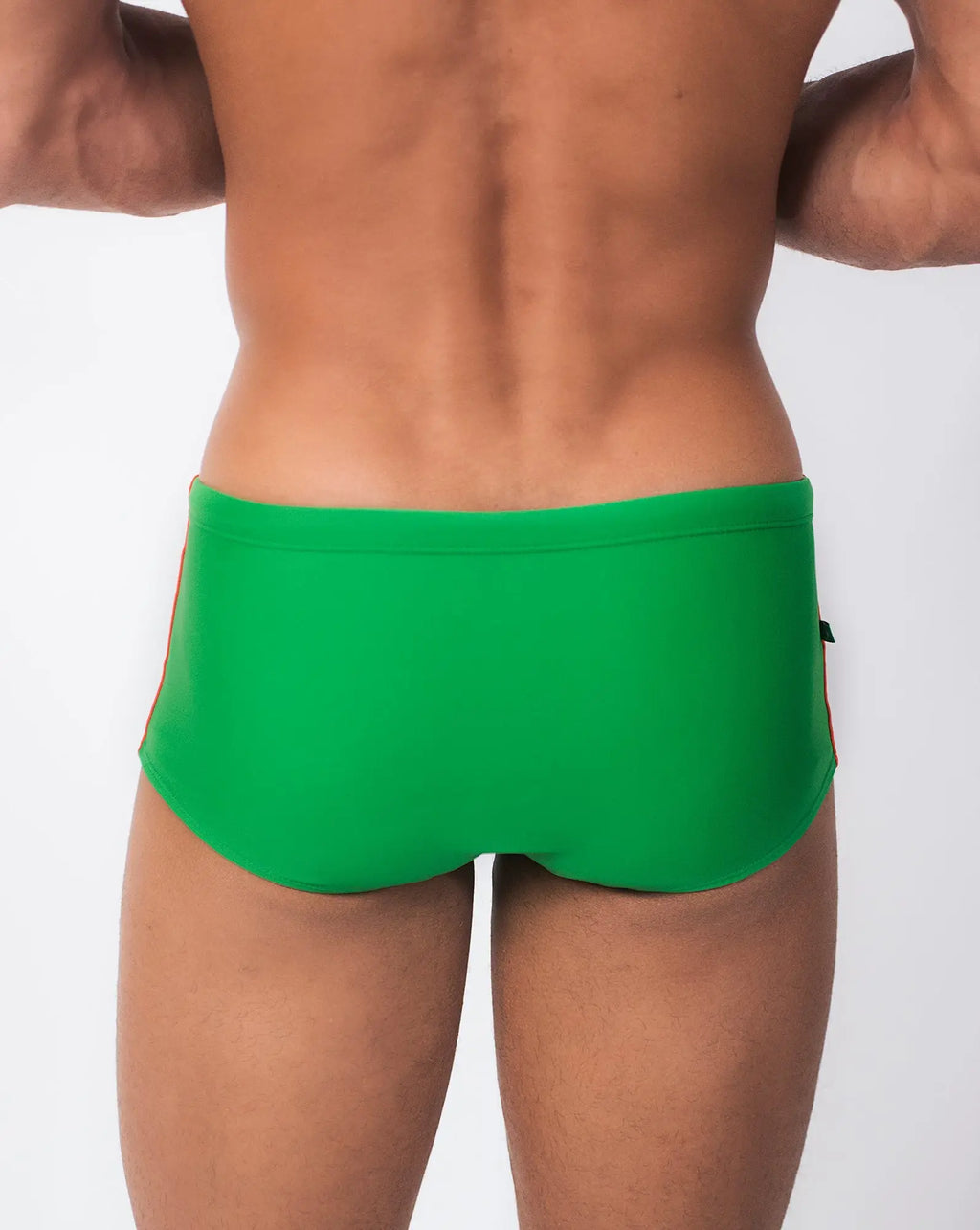 Bright green floripa trio sunga swim shorts with sleek form-fitting design and subtle side trim in classic cut