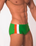 Green floripa trio sunga swim shorts with orange and white side stripe and metallic button on left hip in classic cut