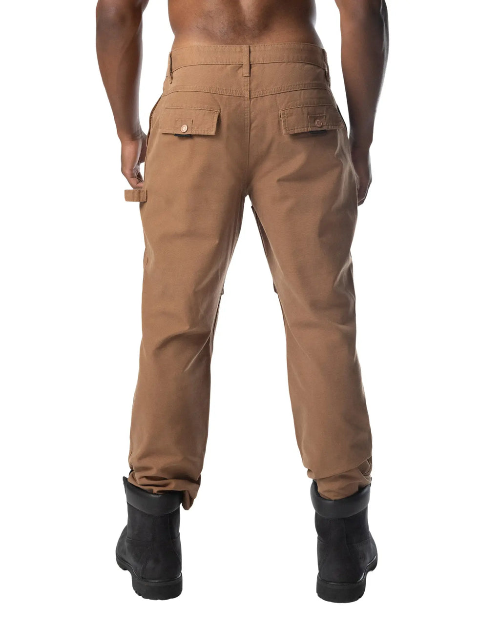 Back view of tan forge pant cargo pants with two flap pockets and a tool loop at the waistband