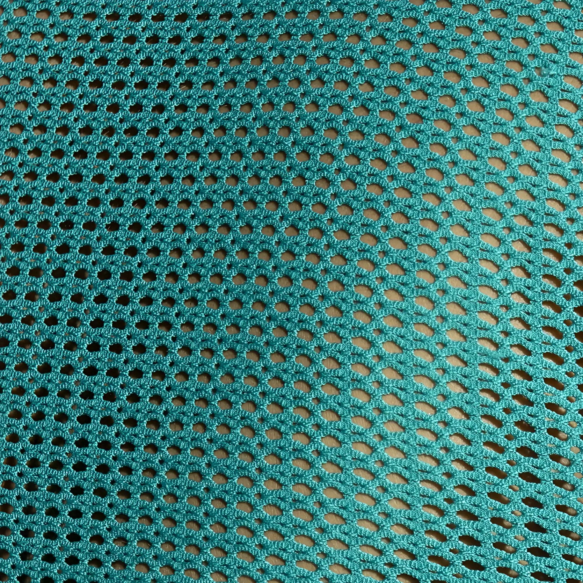 Teal crocheted mesh fabric with oval holes on the back of the Formentera Retro Tank Top