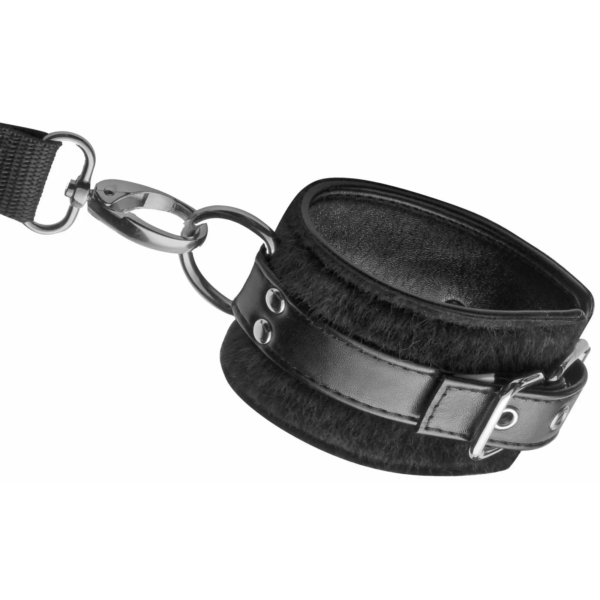 Frisky Frisky 8-Piece Restraint Set: A black faux-leather and plush fur cuff with silver hardware and a lead attachment.