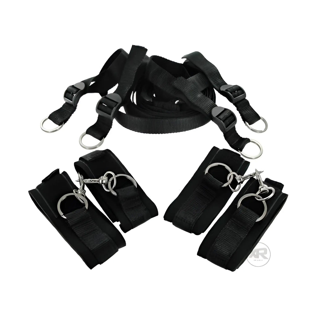 Frisky Bedroom Restraint Kit featuring adjustable black nylon straps, four padded cuffs, and metal hardware.