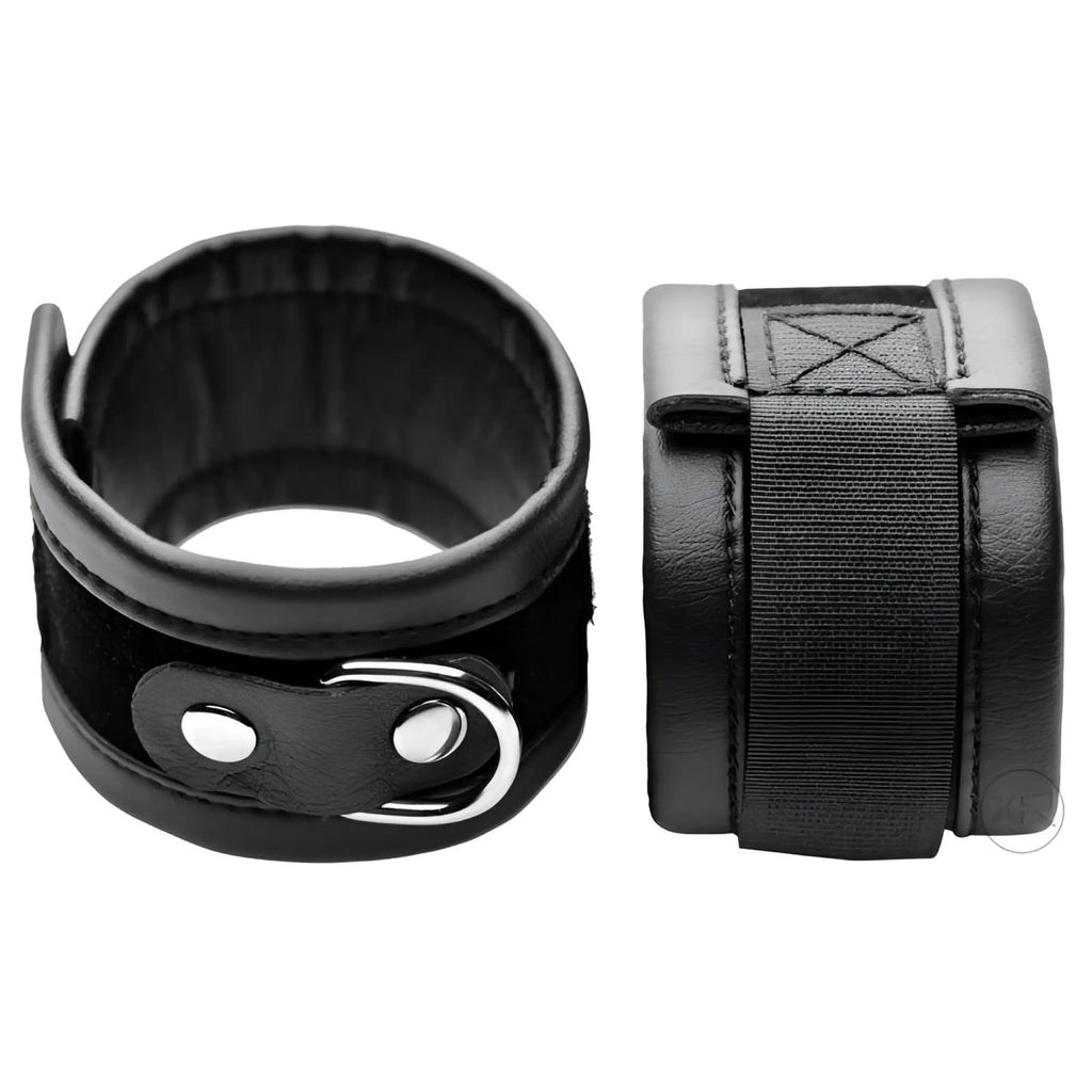 Frisky The Handle Me Wrist Cuffs: A pair of black, padded leather-style wrist restraints with adjustable metal D-rings.