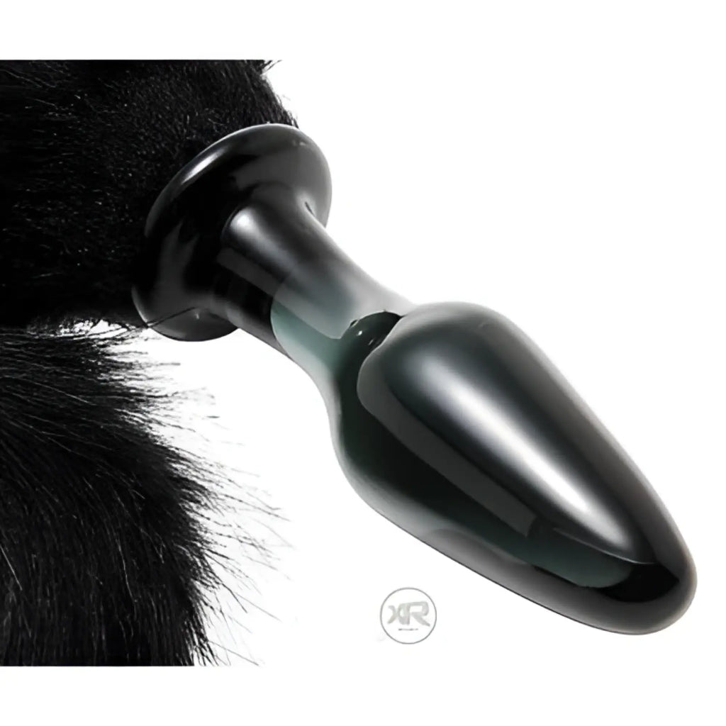 Frisky Midnight Fox glass butt plug with a black faux-fur tail, featuring a smooth, dark, teardrop-shaped glass base.