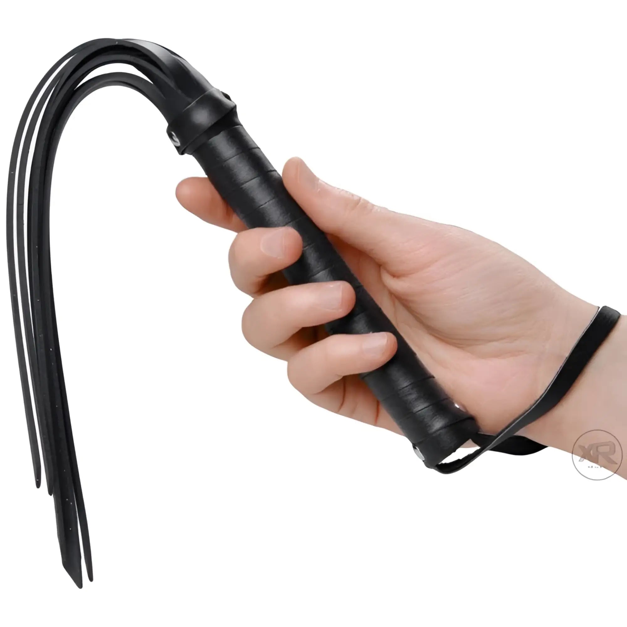 Hand holding a black Frisky Rubber Strand Mini-Flogger with thin, flexible rubber strips and a textured grip handle.