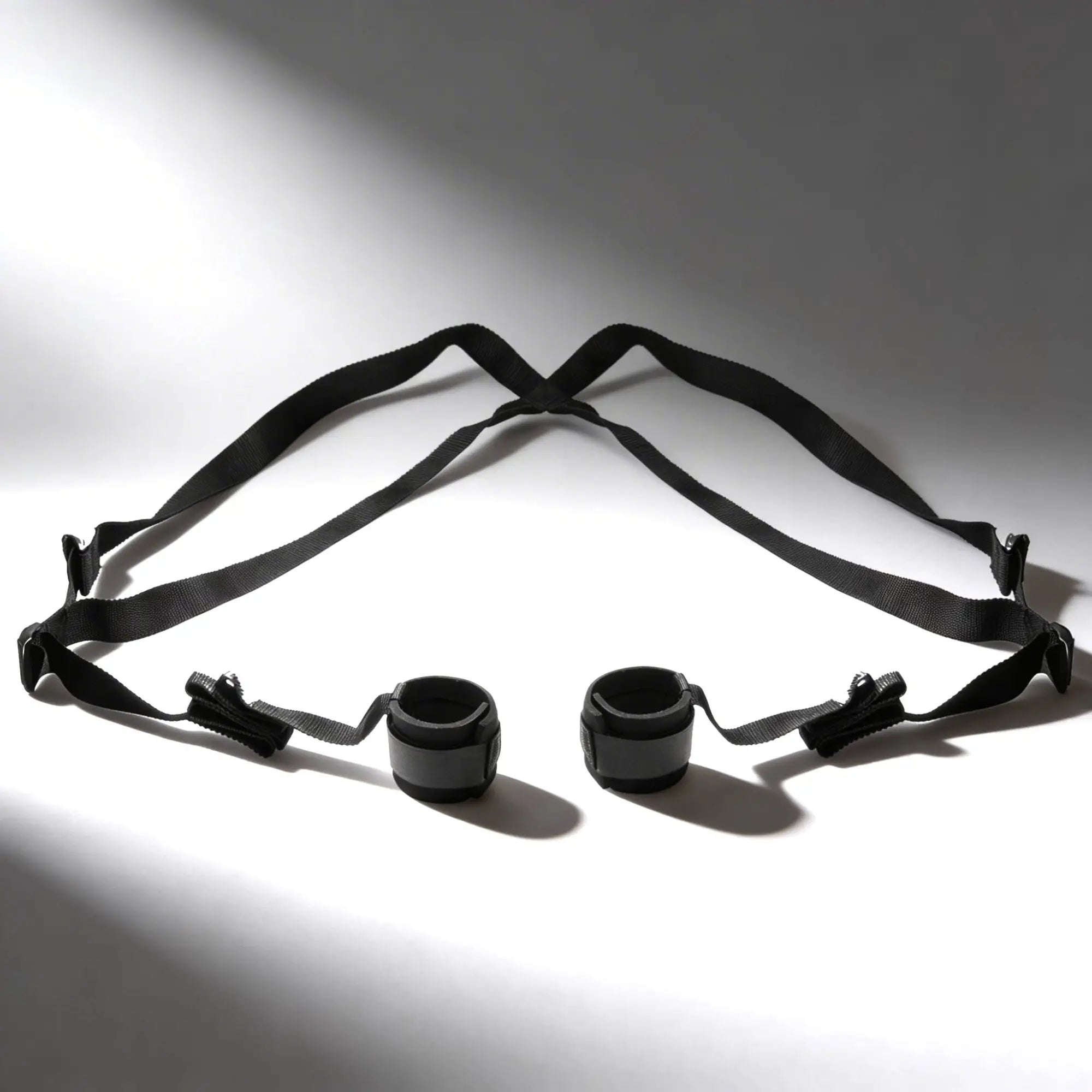 Frisky Do Me Sex Position Sling: A black, adjustable nylon harness featuring two padded cuffs for support.