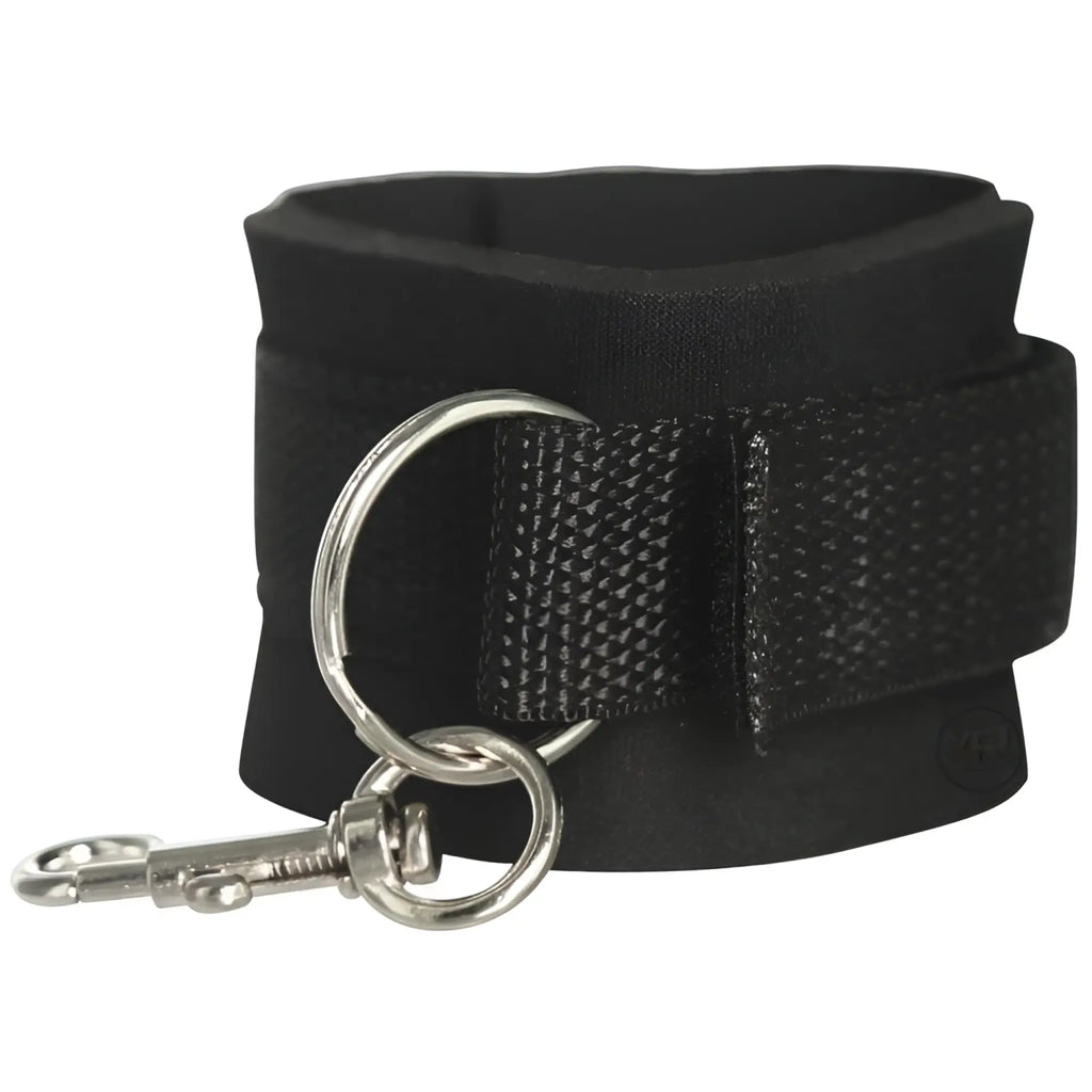 Frisky Stay-Put Hog Tie restraint: a wide, black padded cuff with a silver metal D-ring and a spring-loaded snap hook.