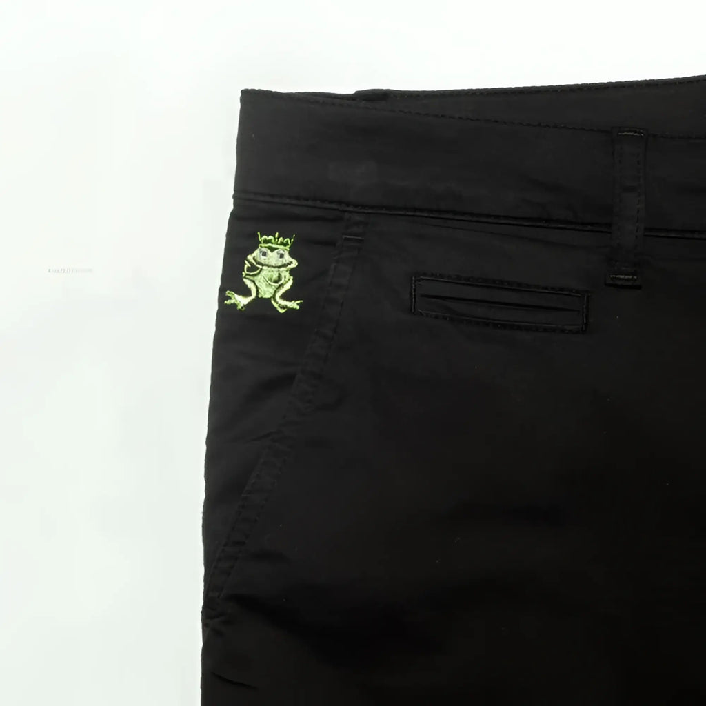 Black denim frog chino short showing back pocket with small embroidered green frog wearing a crown