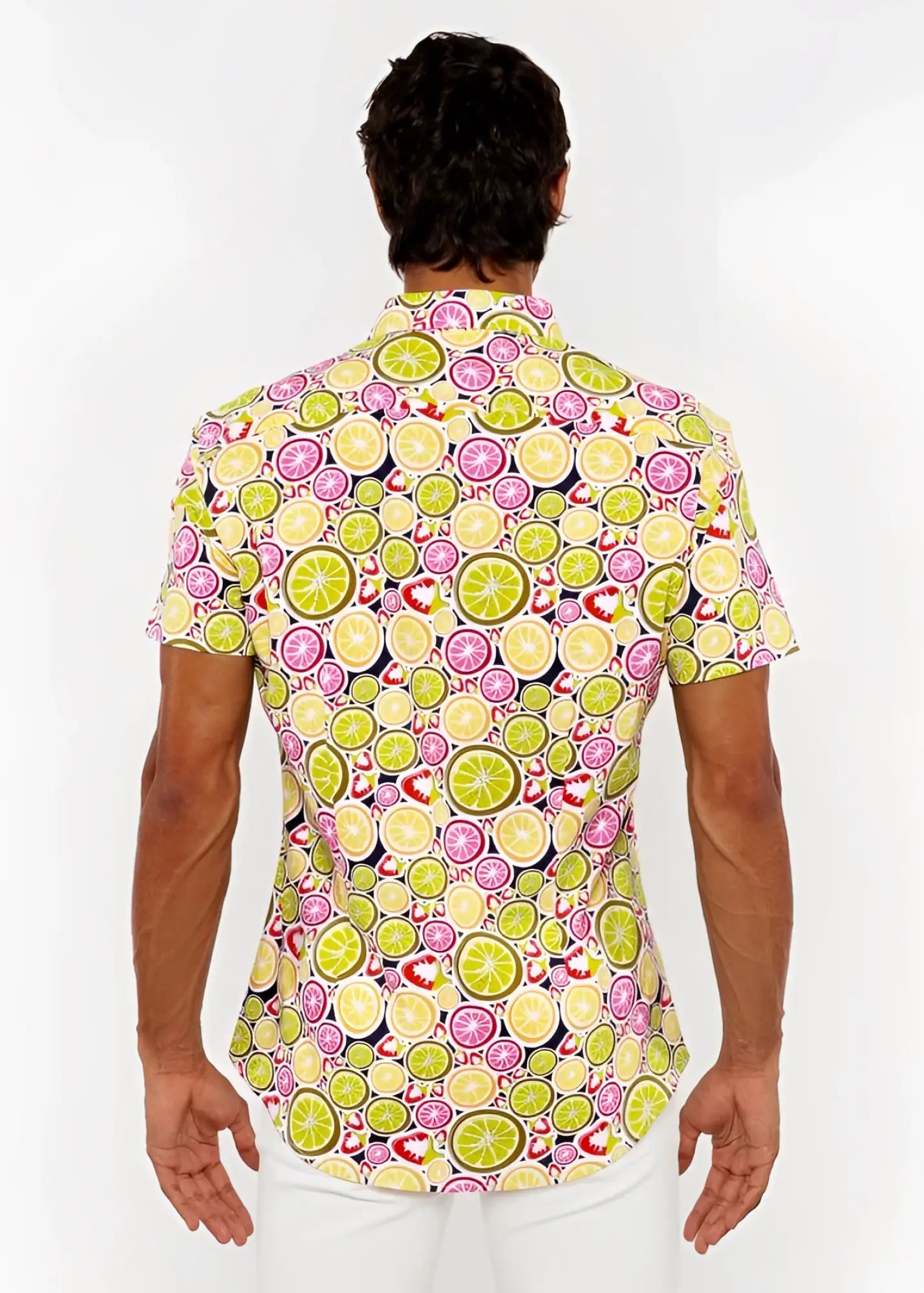 A vibrant fruits print stretch knit short-sleeved shirt with lime and pink citrus slices on dark navy background