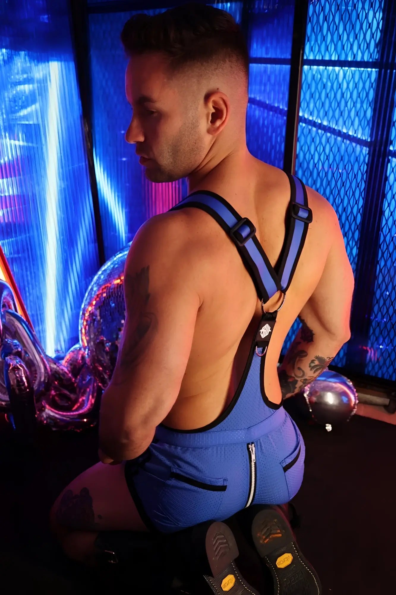 Futura sluterall blue and black harness-style overalls with side zipper detail for functional workwear