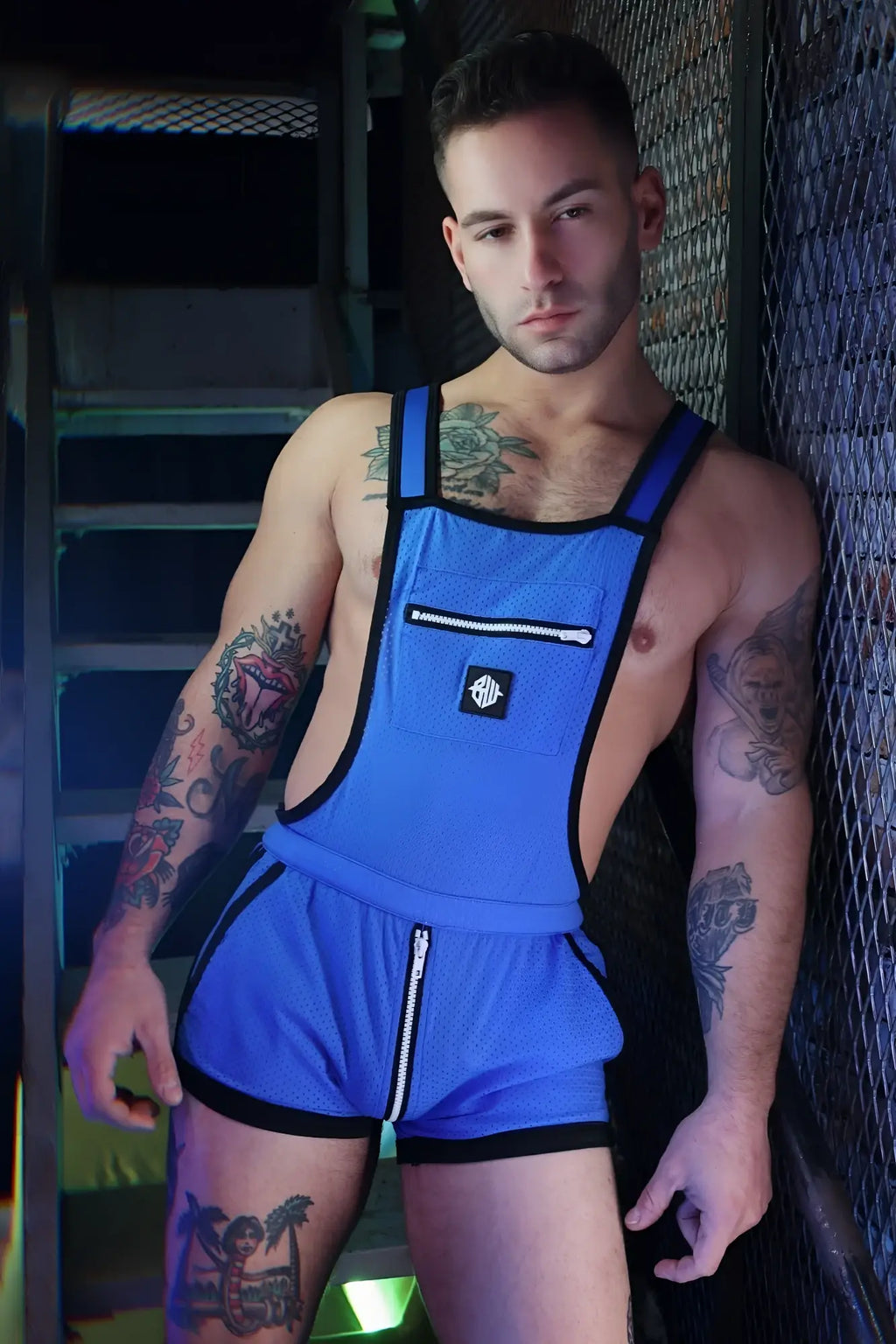Blue mesh overall with black trim and front zipper pocket from futura sluterall for durable workwear use