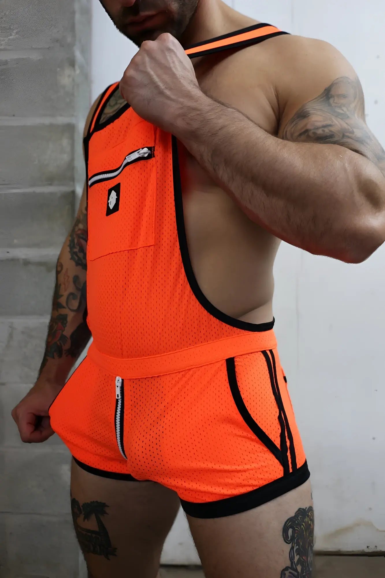 Futura sluterall bright orange mesh athletic singlet with black trim and zipper details for training and running