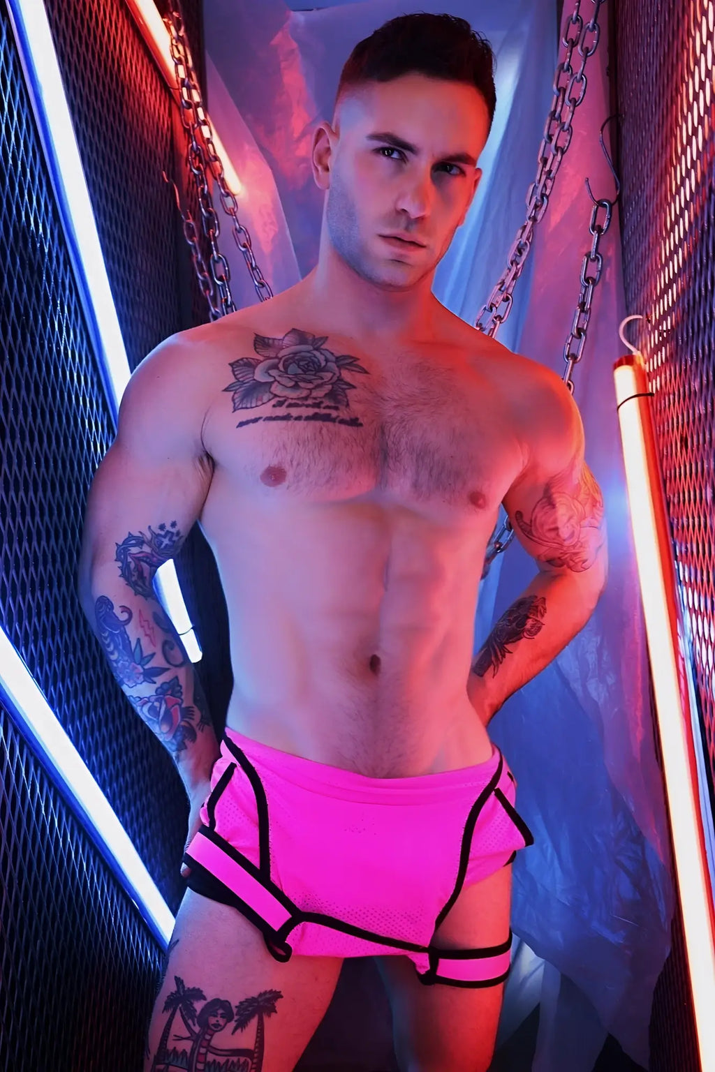 Bright pink futura sluterall athletic shorts with black trim and side straps designed for active wear