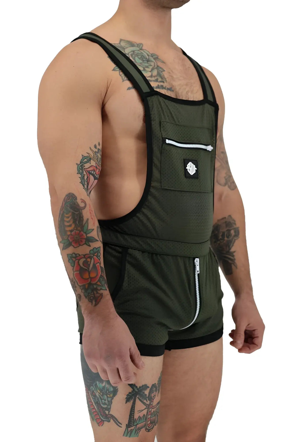 Olive green mesh overalls with black trim and white zipper accents from futura sluterall collection