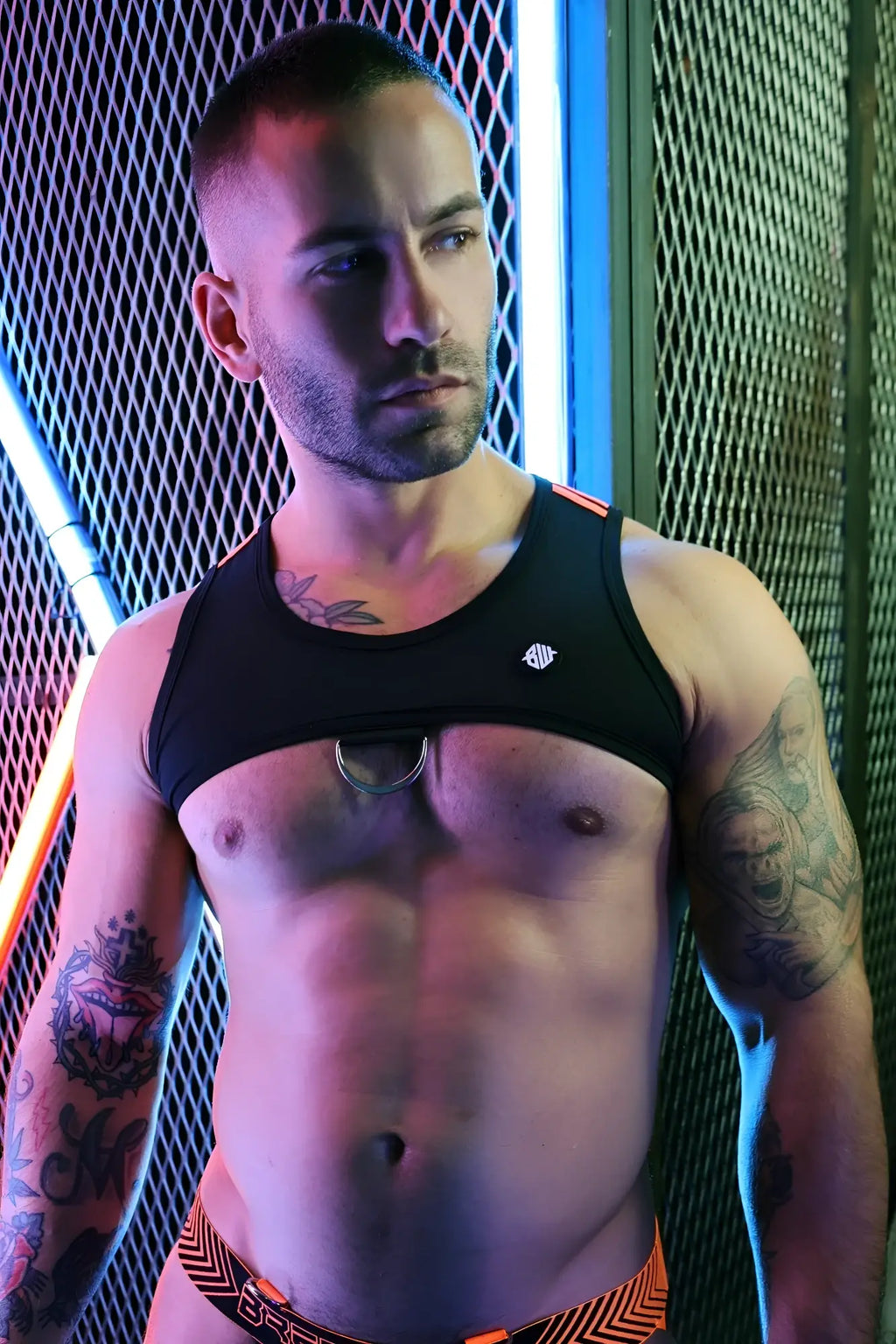 Black Futura tank harness athletic tank top with small white logo and silver ring detail across the sternum