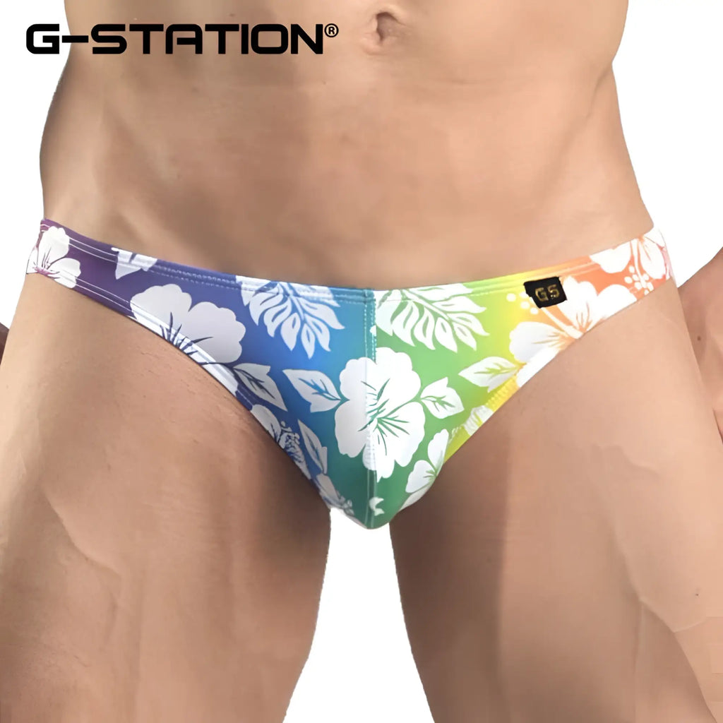 G-station hibiscus bikini underwear rainbow 2102XSJ size M swim trunks with vibrant tropical floral pattern on gradient background