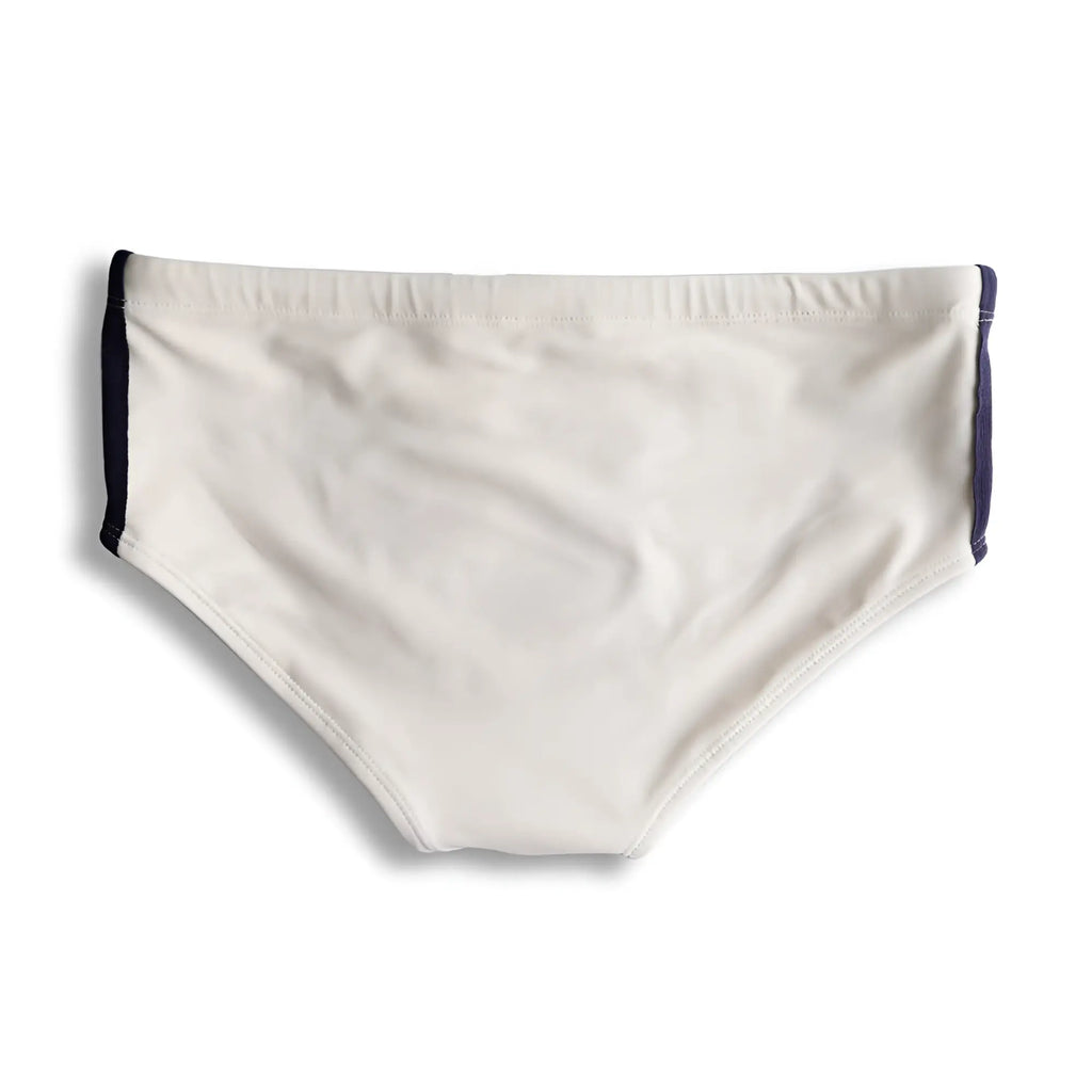 Cream-colored swim trunks galão creme sunga with navy blue side panels designed for stylish beachwear