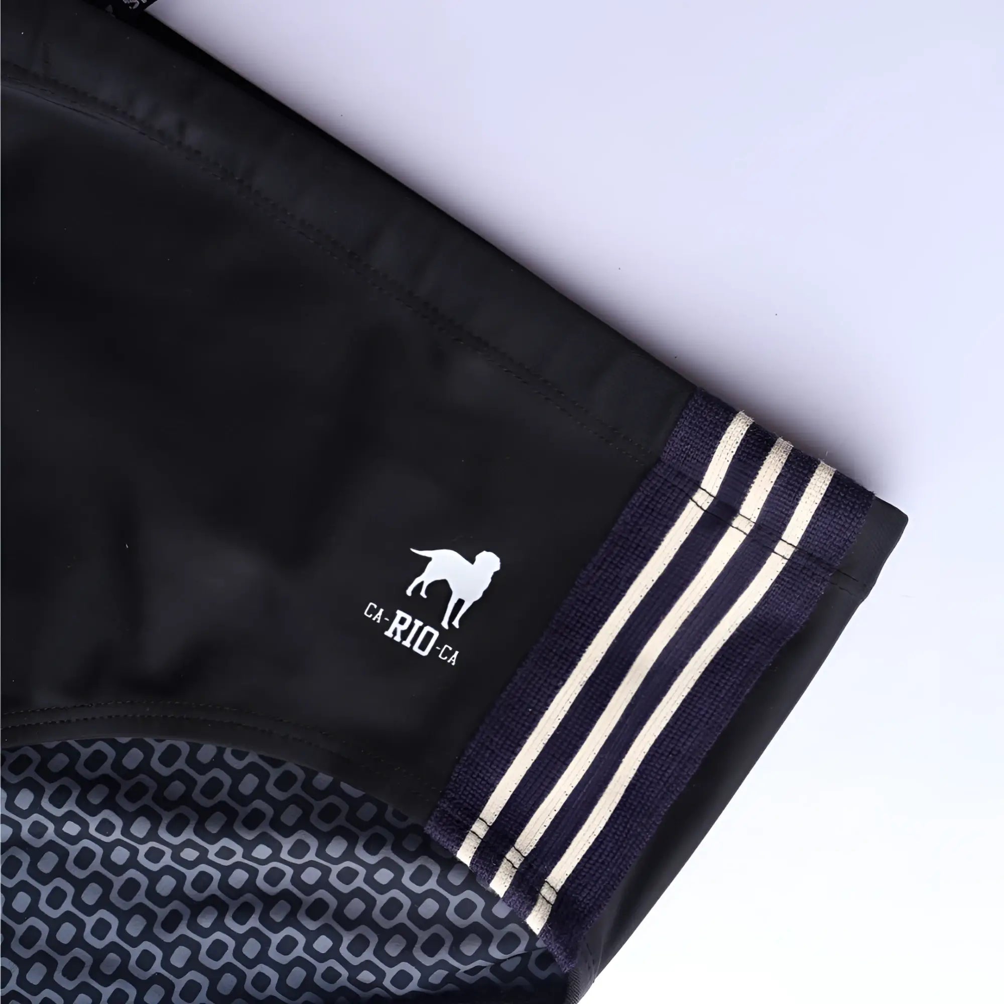 Black athletic swim shorts galão preto sunga with white dog logo ca-rio-ca text and cream side stripes