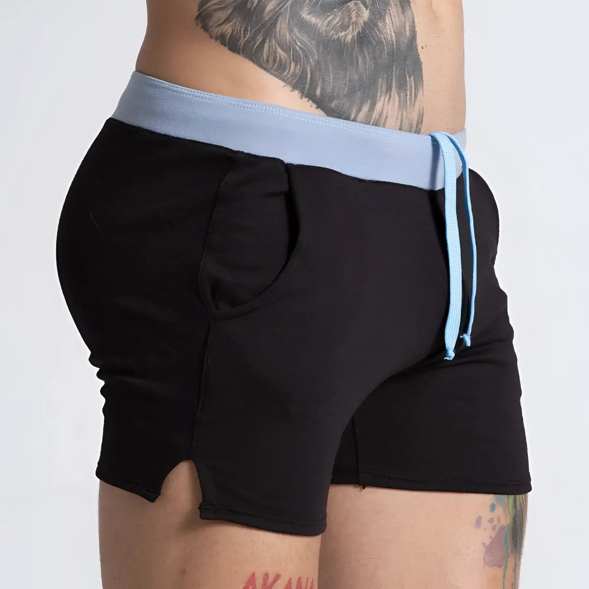 Gigo Alfa black blue shorts feature black athletic fabric with a light blue elastic waistband and matching drawstring