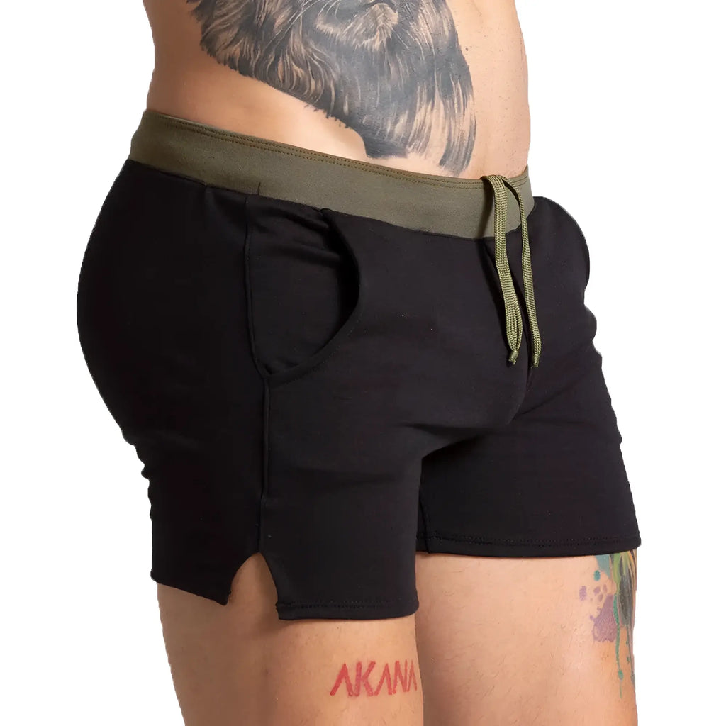 Black athletic shorts with olive green elastic waistband and drawstring side pockets and hem split gigo alfa black green short