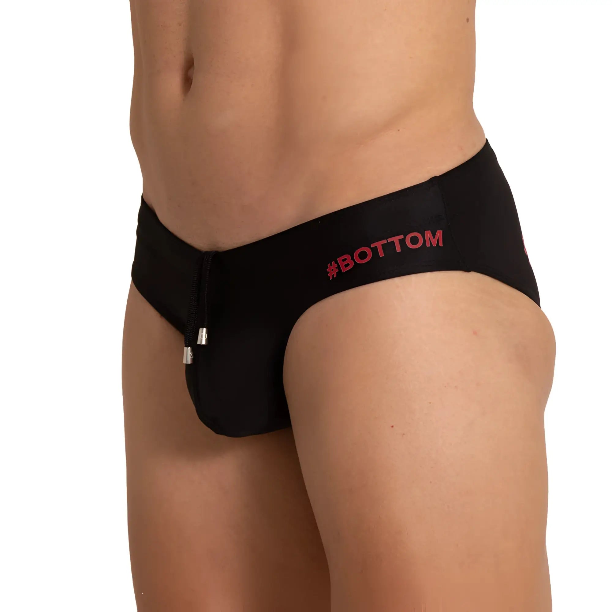Black men’s swim briefs with red bottom logo and silver zipper pull in gigo bottom black swim brief design