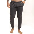 Dark gray pinstripe joggers with elastic cuffs and a subtle button at the waistband from gigo casual sportpants