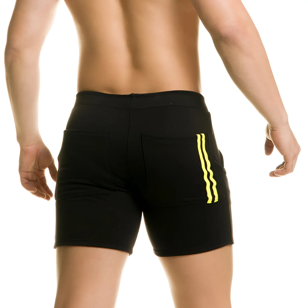 Gigo Chari black athletic shorts with bold yellow vertical stripes on side pockets for activewear use