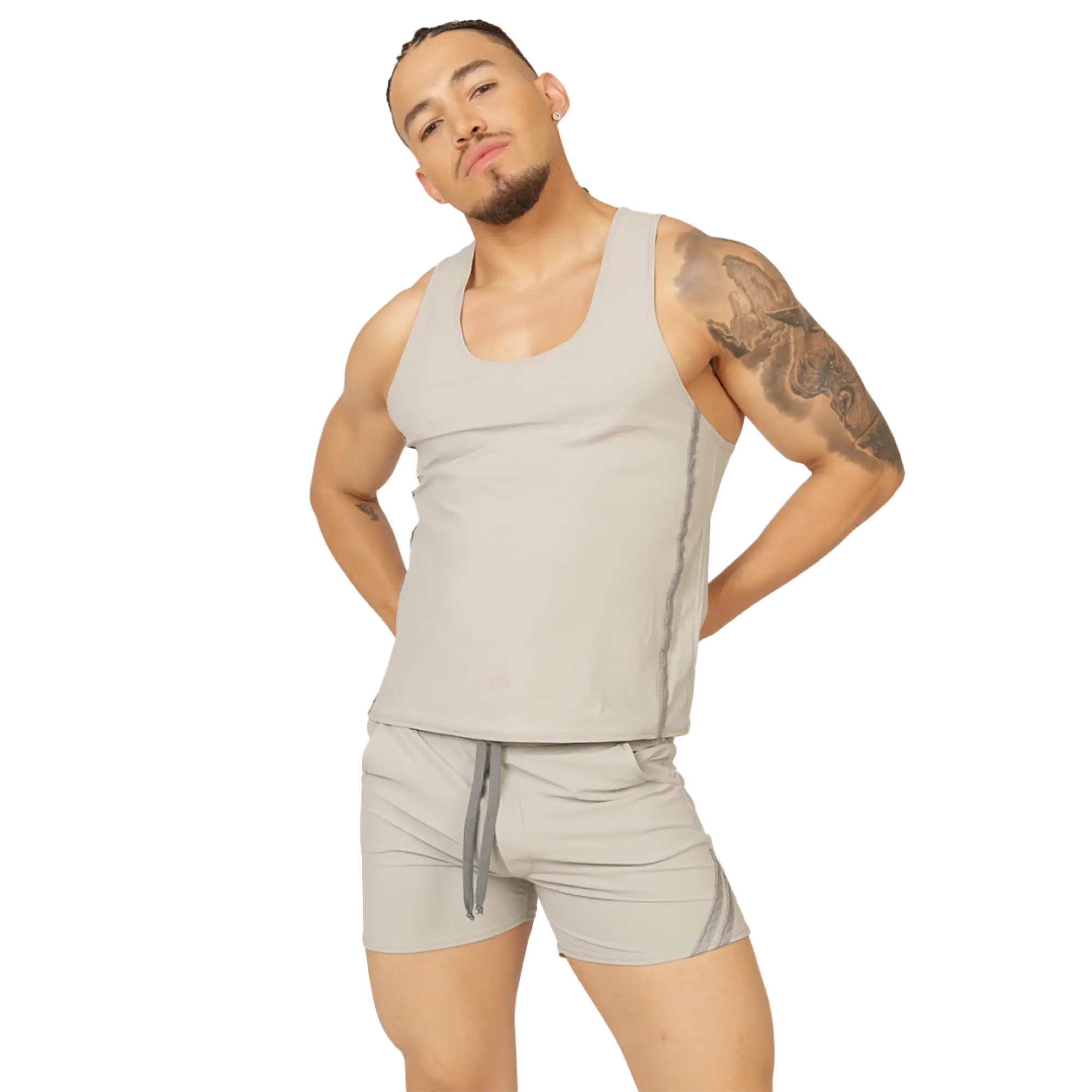 A man wearing a gigo club gray tank sleeveless light gray tank top with subtle side seams and matching shorts with drawstring waistband