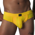 Bright yellow, textured mesh brief with a supportive pouch, tonal piping, and a small black rectangular logo patch.
