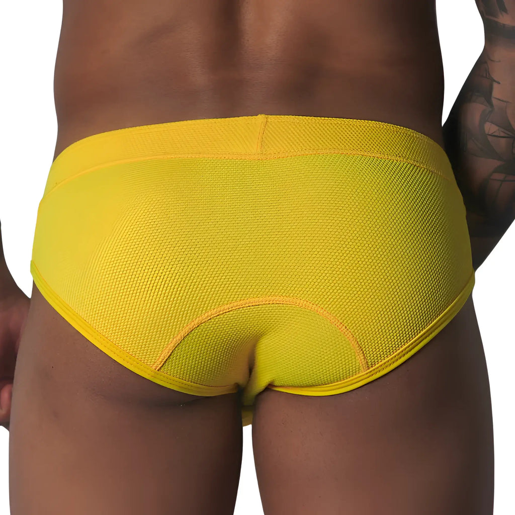 Bright yellow, textured mesh brief with curved seam detailing on the back, shown from behind.