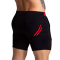 Black athletic shorts with red striped accents on waistband and side pocket gigo f fetish red short