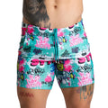 Gigo figure beachwear vibrant turquoise and pink swim trunks with bold graffiti street art patterns for summer wear
