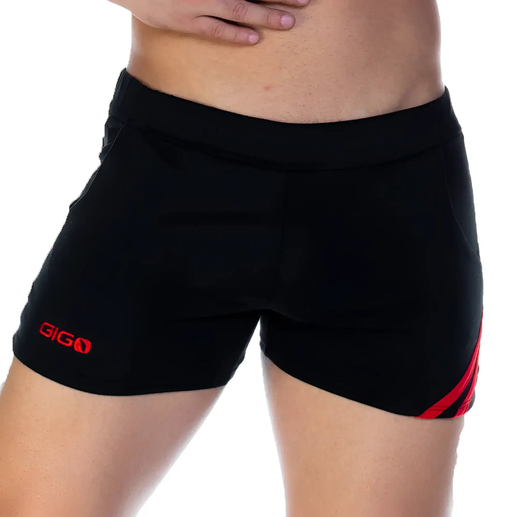 Black athletic shorts with red side stripes and gigo logo on the left leg from the gigo forever black red short line