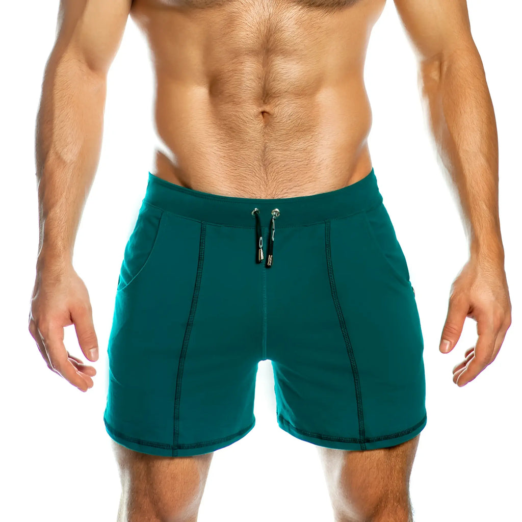 Teal athletic shorts with black drawstring and stitching details in gigo frozen green short design