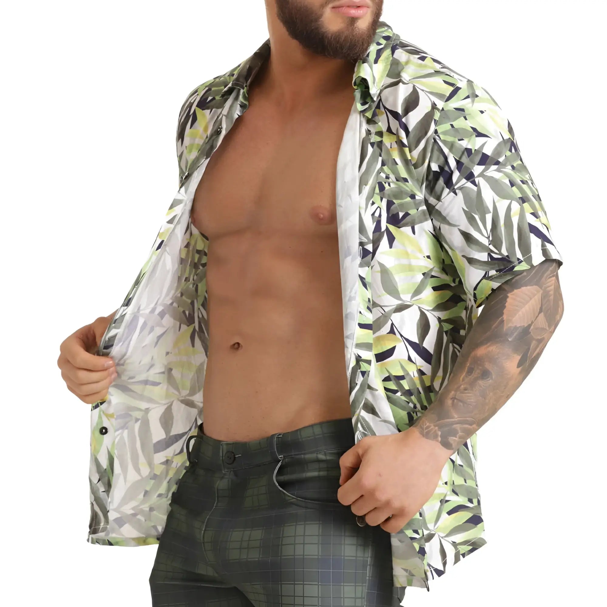 A man wearing a gigo jungle shirt short-sleeved button-up with green white and black leaf pattern