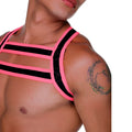 A bold neon pink and black strappy harness top with a geometric cage like design called gigo medieval candy harness