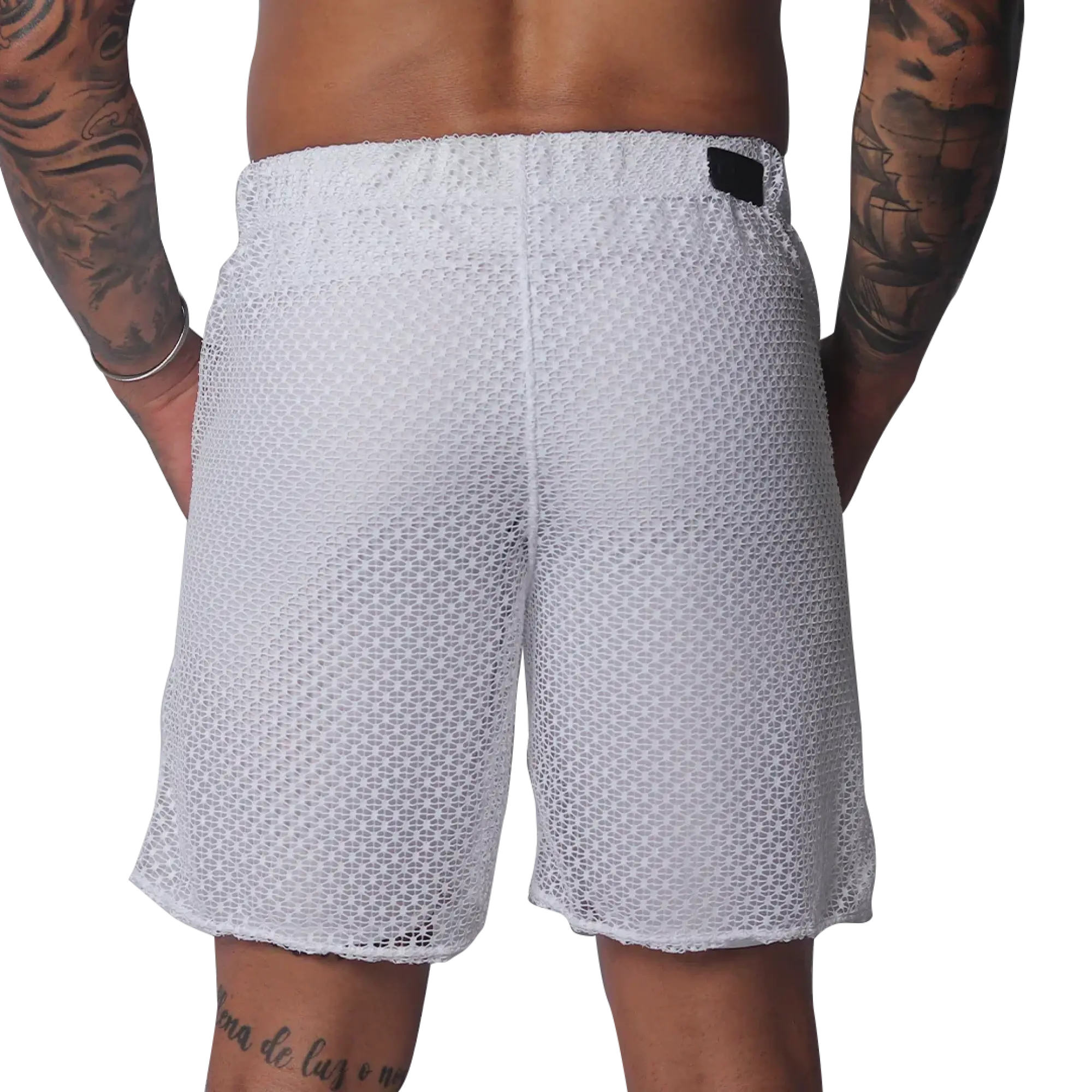 White mesh athletic shorts with an elastic waistband and a small black rectangular brand patch on the back.