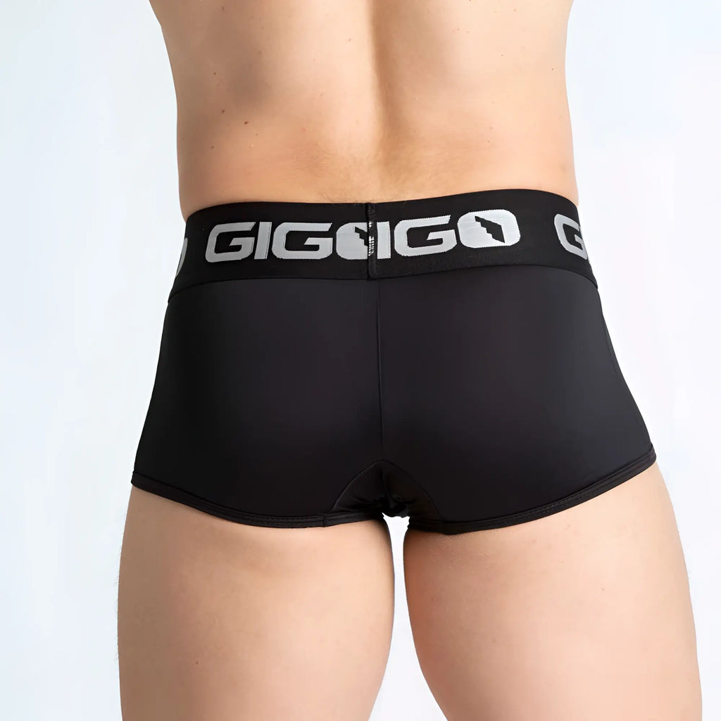 Black gigi go men’s briefs with silver logo band made from breathable material in the gigo purity black trunk style