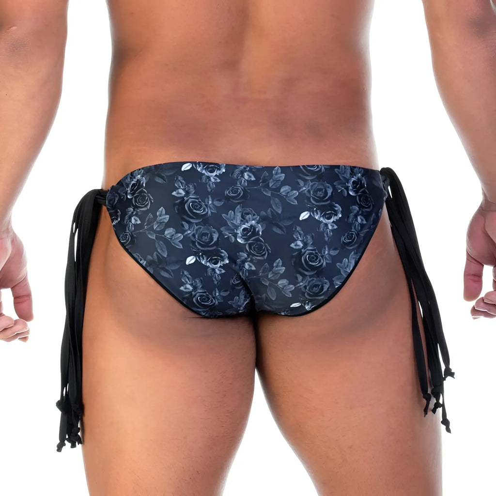 Dark blue floral-patterned gigo rose black swim brief with black side ties designed for swimming and beach use