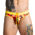 Bright yellow gigo salad swim brief swim trunks with colorful sliced strawberries and kiwi print for summer use