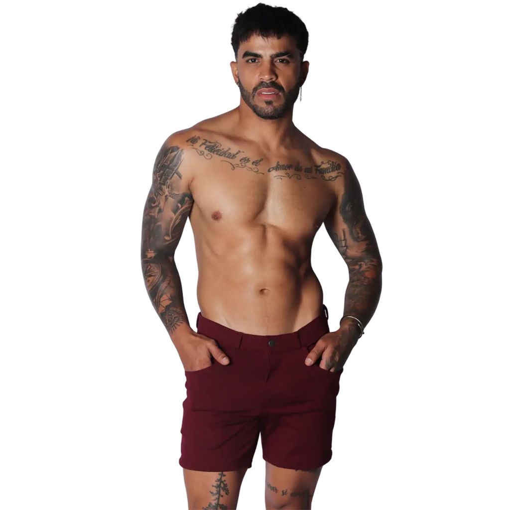 Wine-colored tailored shorts featuring a flat front, button closure, and slim-fit silhouette.