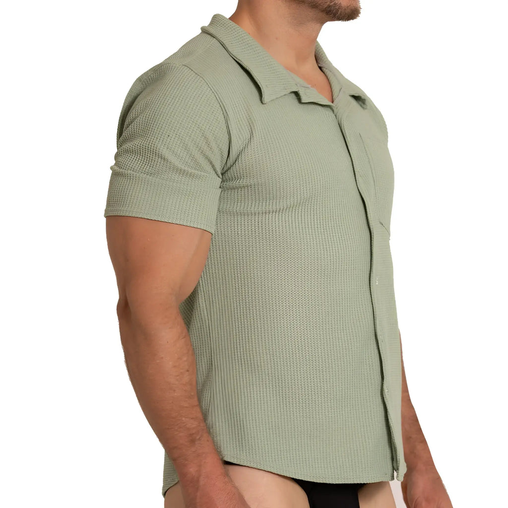 A men’s short-sleeved polo shirt in muted sage green with textured waffle knit and classic collar gigo tissue green shirt