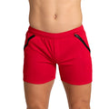 Gigo training red athletic shorts with black side zipper accents designed for active wear and training sessions