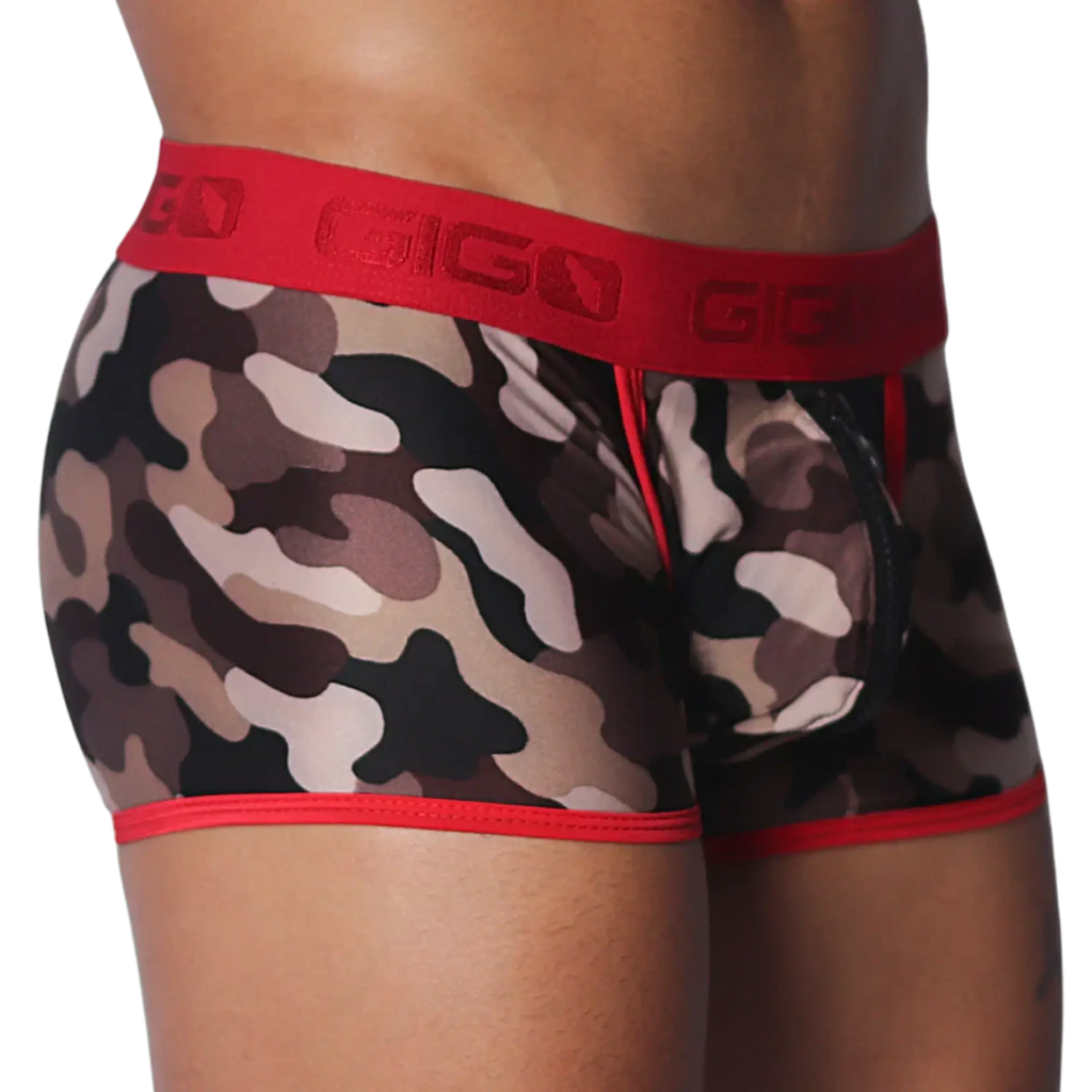 Camouflage print trunks with a red Gigo branded waistband, red trim, and a black zippered front pouch.