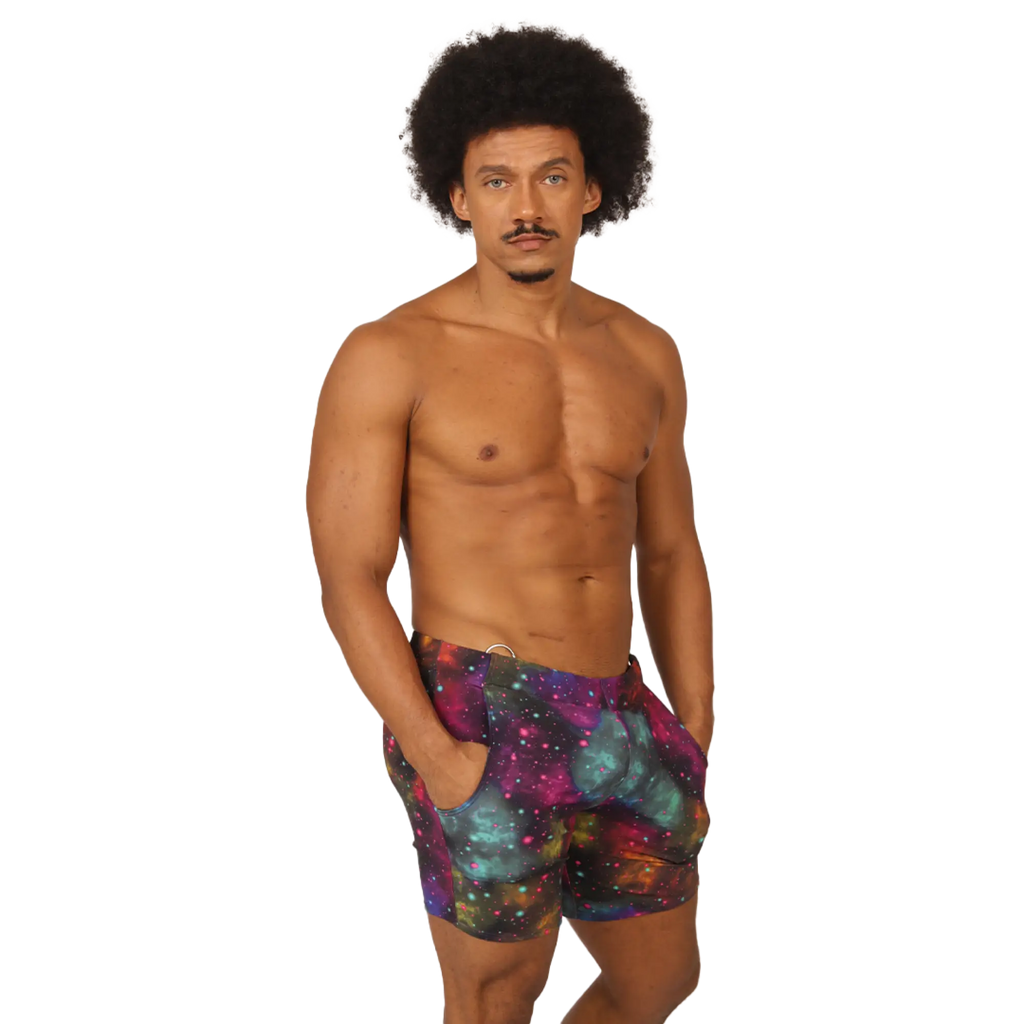 Men’s galaxy-print swim trunks in purple teal and pink cosmic nebula design from Gigo Universe Beachwear